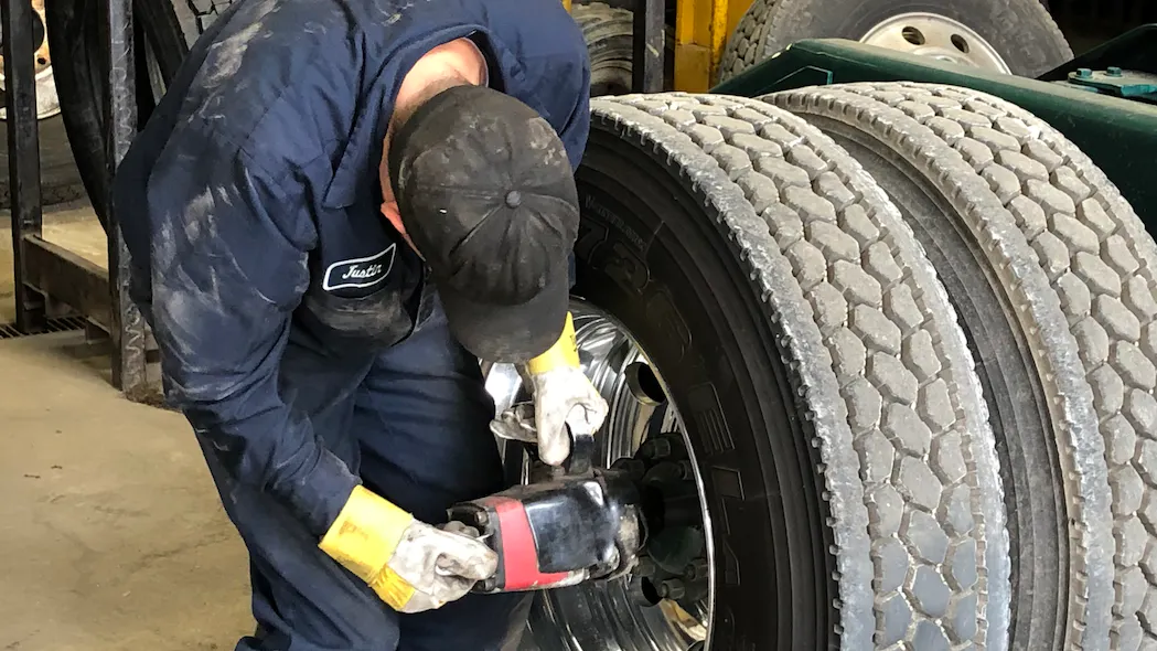 technician working on tire